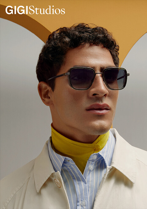 Gigi Studios Jeune homme avec lunettes de soleil grand verres